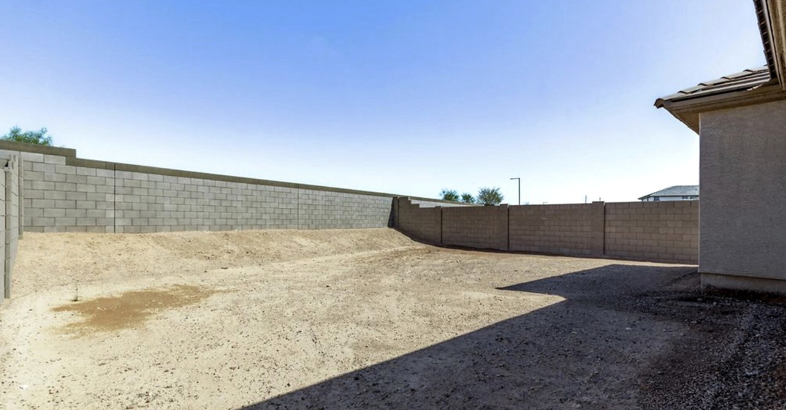 Unfinished backyard before landscaping